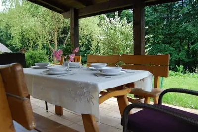 a table and chairs sitting on a patio at Gosidomek in Zawoja