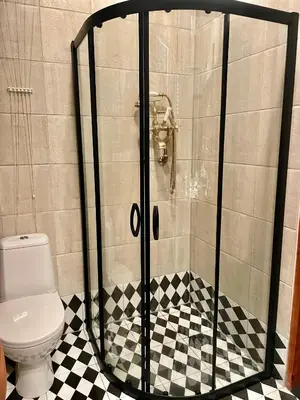 a shower stall with a toilet in a bathroom at Old Town Krakow! Amazing location & character in Kraków