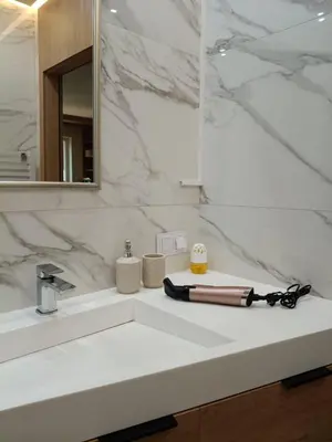 a bathroom with a white sink and a mirror at Apartament Lena Stare Miasto in Kraków