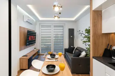 a living room with a couch and a table at Comfort, prestige, best location Romanowicza 1 in Kraków