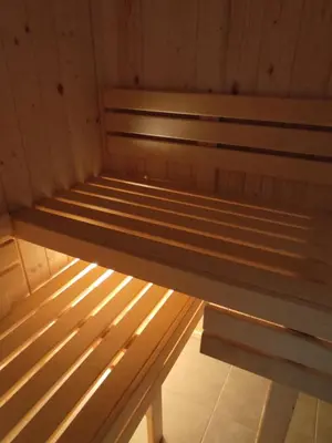 a wooden cabin with two beds in it at Trzy Małe Drzewka in Wielka Wieś