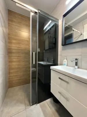 a bathroom with a shower and a sink at Trzy Małe Drzewka in Wielka Wieś