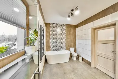 a bathroom with two sinks and a mirror at Apartament Turbacz in Klikuszowa