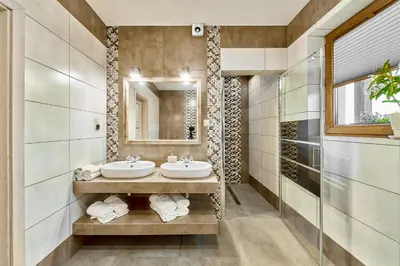a bedroom with a bed and a kitchen with a counter at Apartament Turbacz in Klikuszowa