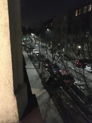 a view of a street at night from a building at Main Square Apartaments in Kraków