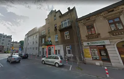 a street with cars parked in front of buildings at Duo 2 Debniki Modern Apartment near Old Town Fast Wi-Fi Self Check-in in Kraków
