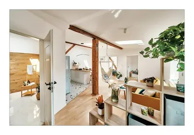 a living room filled with lots of plants at Sunny Apartment at the Heart of Old Town in Kraków