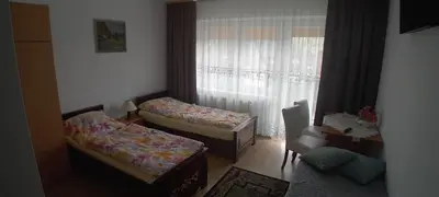 a room with two beds and a window at amel orawa in Podwilk