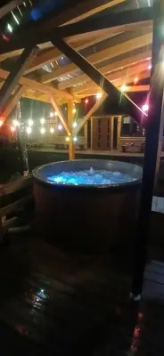a large hot tub in a building with lights at amel orawa in Podwilk
