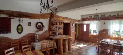 a kitchen and dining room with a table and chairs at amel orawa in Podwilk