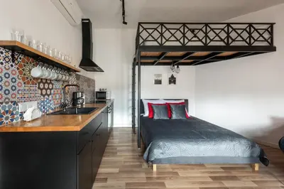 a bedroom with a bed and a sink in a room at Modern APARTMENT ARIZONA STUDIO OLD TOWN Dietla balcony in Kraków
