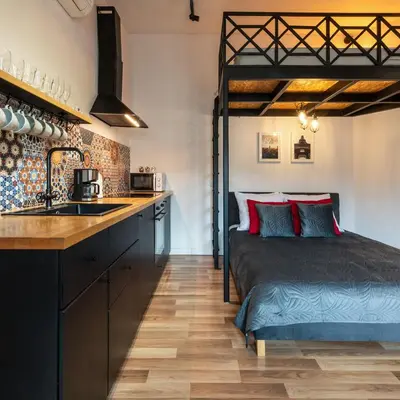 a bedroom with a bed and a sink in a room at Modern APARTMENT ARIZONA STUDIO OLD TOWN Dietla balcony in Kraków