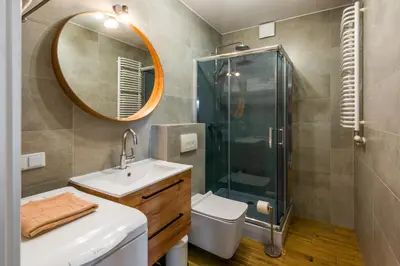 a bathroom with a shower and a sink and a mirror at Modern APARTMENT ARIZONA STUDIO OLD TOWN Dietla balcony in Kraków
