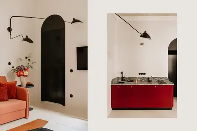 a living room with a red cabinet and a red couch at Stylish apartment close to Wawel, Old Town Studio, Main Sq. 3 min in Kraków