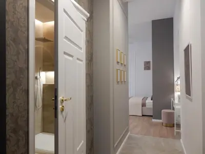 a hallway with a door leading to a bedroom at MyFive Apartments Kraków in Kraków