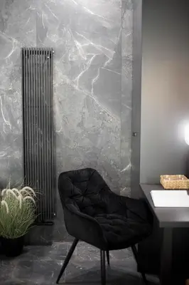 a black chair in a bathroom with a sink at Jacuzzi Apartment Main Square in Kraków
