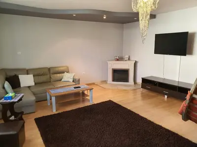 a living room with a couch and a tv at Cztery Pory Roku in Rabka