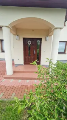 a front door of a house with a brick driveway at Cztery Pory Roku in Rabka