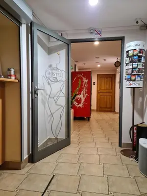 a room with a glass door with a drawing on it at AMBER APARTAMENt 11 in Kraków