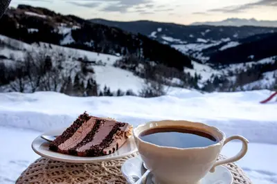 a piece of cake and a cup of coffee at Gorczańskie Siedlisko in Ochotnica Górna