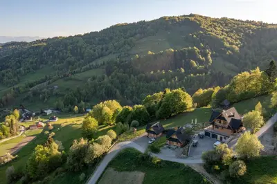 an aerial view of a house on a hill at Gorczańskie Siedlisko in Ochotnica Górna