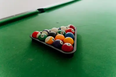 a tray of billiard balls on a pool table at Dom Wypoczynkowy U STASKA in Ochotnica Dolna