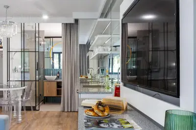 a bathroom with a sink and a mirror at Fragola Apartments Vistula View in Kraków