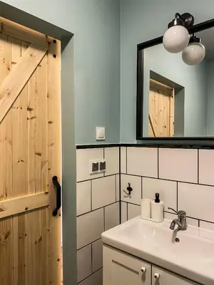 a bathroom with a sink and a mirror at Cozy Apartment in the heart of Jewish District in Kraków