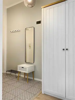 a dressing room with a mirror and a dressing table at Cozy Apartment in the heart of Jewish District in Kraków