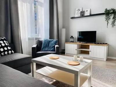 a living room with a couch and a coffee table at Cozy Apartment in the heart of Jewish District in Kraków