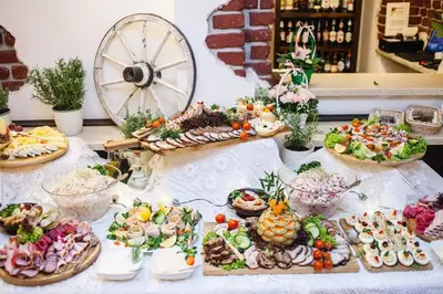 a table topped with lots of different types of food at Dworek Złoty Róg Hotel i Restauracja in Kraków