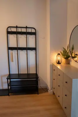 a room with a dresser and a mirror and a dresser at Apartamenty na Wzgórzu in Bochnia
