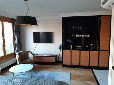 a living room with a couch and a tv at KR47 Kossak Residence in Kraków