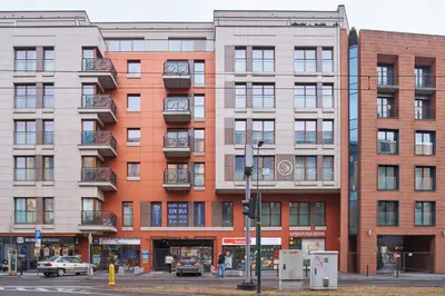 a building on the corner of a city street at D&A Apartments Pawia in Kraków