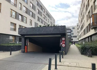 a tunnel in a city with a building at Apartment on the Boulvard in Kraków