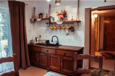 a kitchen with a sink and a counter top at Dom Pod Lasem 44 in Klecza Górna