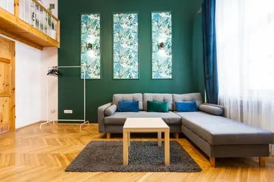 a living room with a couch and a table at VINTAGE SZPITALNA APARTMENT in Kraków