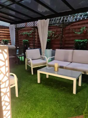 a living room with a couch and a table and chairs at AMBER APATRTAMENt 7 in Kraków