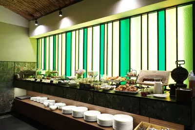a buffet line with plates of food on a table at Liebeskind Boutique Hotel Old Town in Kraków