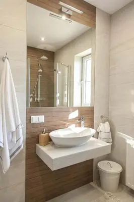 a bathroom with a sink and a toilet and a mirror at Willa pod Lanckoroną in Izdebnik