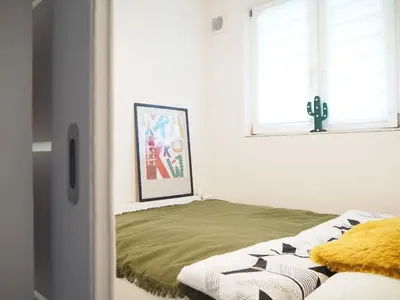 a bedroom with a bed and a window at Telimeny in Kraków