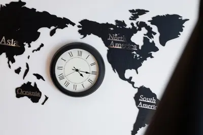 a clock in the shape of a map of the world at Cosy Apartment at the Main Station by Noclegi Renters in Kraków