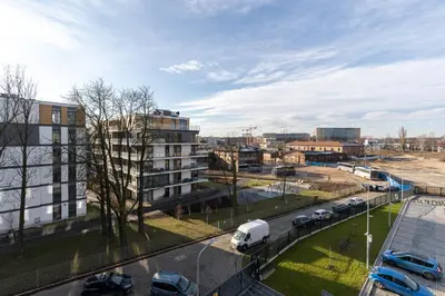 a city with cars parked in a parking lot at Angel Apartments 1 in Kraków