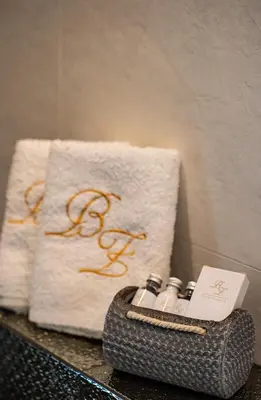 a group of towels and bottles on a counter at Boski Zakątek in Wielka Wieś