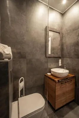a bathroom with a toilet and a sink at Boski Zakątek in Wielka Wieś