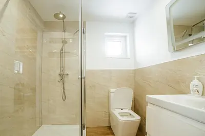 a bathroom with a shower and a toilet and a sink at Ostoja Jaworskie in Stryszawa