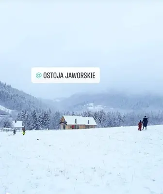 a group of people standing in a snow covered field at Ostoja Jaworskie in Stryszawa