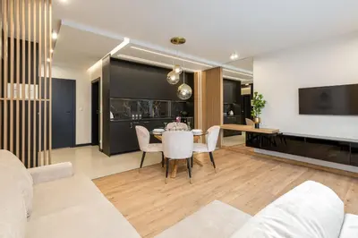 a living room with a couch and a table at Glossy Apart G20 in Kraków