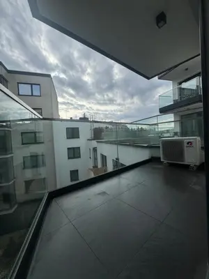 a balcony with a view of a building at Glossy Apart G20 in Kraków