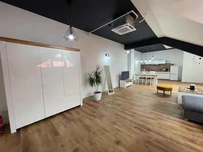 a living room with a couch and a table at Apartament Rynek 13 z parkingiem - Centrum Bochni in Bochnia